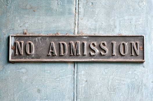 An antique no admission board in an ancient church in India