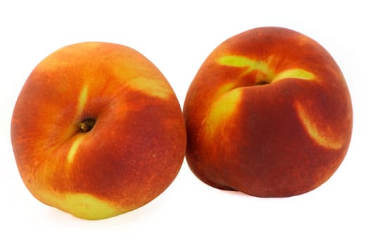 This is a close-up of two peaches.