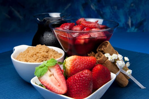 strawberries with red wine, cinnamon and brown sugar on a colore