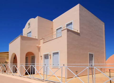 Big colorful house at Oia by beautiful weather, Santorini, Greece