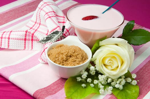 a  strawberry yogurt on a colored background