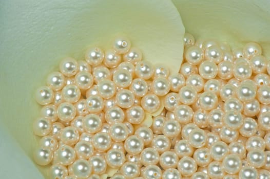 pearls scattered on a colored background fabric