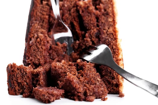 Broken chocolate cake with two forks