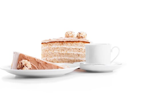 Nut cake with coffee on white background