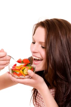 Happy woman eating salad against white background