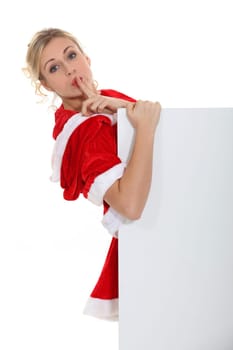 Woman with her finger on her lips