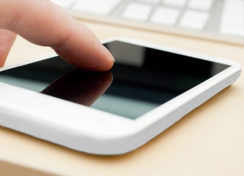 Closeup of Man's Hand Touching Screen of White Modern Smartphone - Shallow Depth of Field