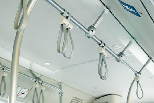 Handles for standing passenger inside a bus