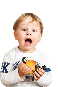 The little boy with an apple and sweets