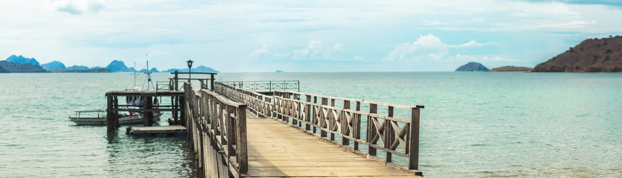 Panorama of Komodo bay. Pier on the foreground