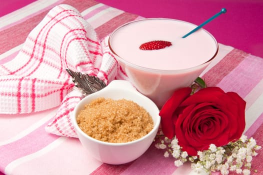 a  strawberry yogurt on a colored background