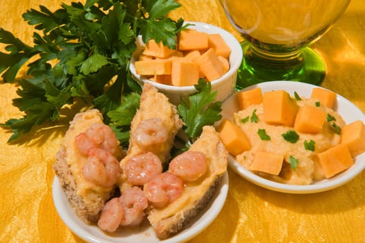 cream of pumpkin and shrimp with nutmeg and parsley on a colored background