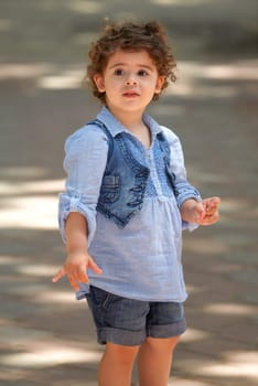 Portrait of happy two year old little girl outdoor.
