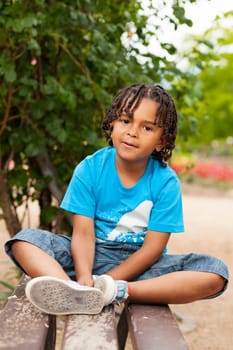 Outdoor portrait of a cute african american little boy