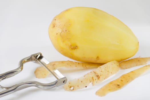 Potato that is in the process of being peeled