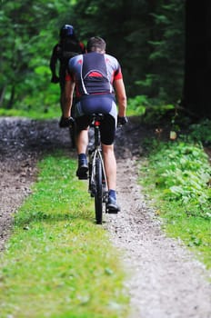 healthy lifestyle and fitness concept with mount bike man outdoor