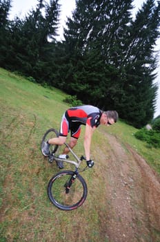 healthy lifestyle and fitness concept with mount bike man outdoor