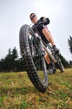 healthy lifestyle and fitness concept with mount bike man outdoor