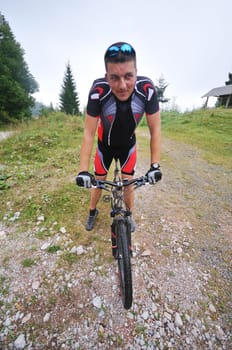 healthy lifestyle and fitness concept with mount bike man outdoor