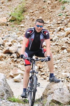 healthy lifestyle and fitness concept with mount bike man outdoor