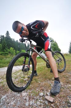 healthy lifestyle and fitness concept with mount bike man outdoor