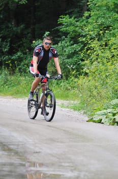 healthy lifestyle and fitness concept with mount bike man outdoor