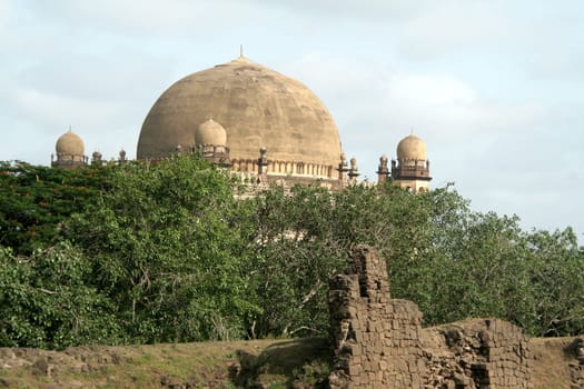 Gol Gumbaz behind green vegetation, Bijapur, Karnataka, India, Asia