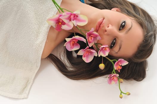 beauty halth and spa wellness isolated young woman face portrait closeup with towel and flower treatment
