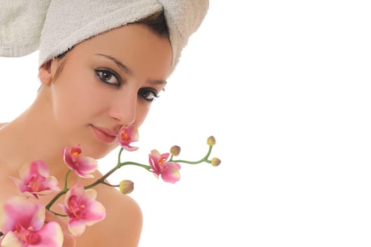 beauty halth and spa wellness isolated young woman face portrait closeup with towel and flower treatment
