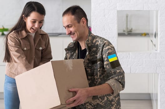 Father in Ukrainian military uniform and his daughter. Family reunion.