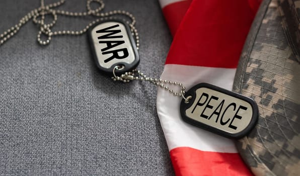 army blank, dog tag with text war peace on the khaki texture background. military concept. High quality photo
