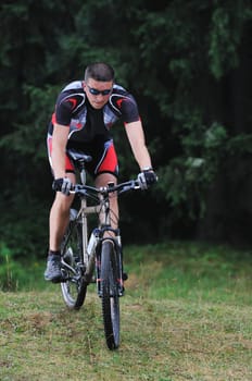 healthy lifestyle and fitness concept with mount bike man outdoor