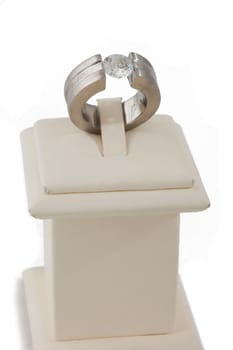 Studio shot of diamond ring on display stand