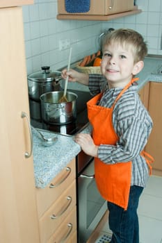 Boy cooking soup