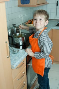 Boy cooking soup