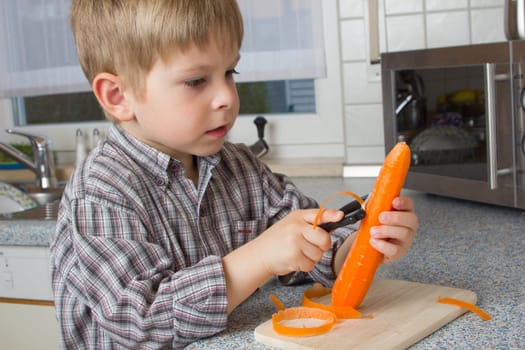 Child peeling carrots