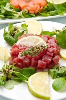 salmon, tuna and swordfish tartare with fresh salad