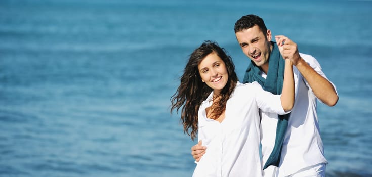 happy young couple in white clothing  have romantic recreation and   fun at beautiful beach on  vacations