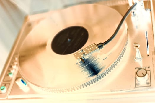 Shaded wiew of vinyl player and placed vinyl
