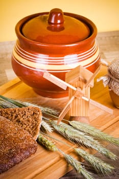 sliced bread and wheat on the wooden table