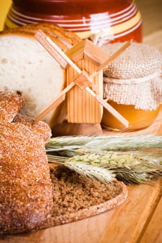 sliced bread and wheat on the wooden table