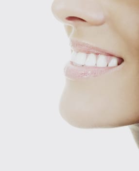 young woman with white teeth smiling representing healthy lifestyle and teeth concept