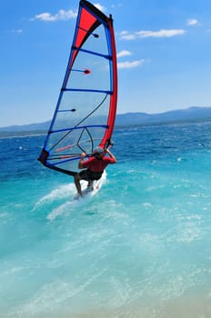 man wind sirfing and have healthy lifestyle