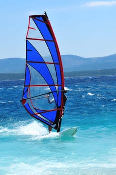 man wind sirfing and have healthy lifestyle