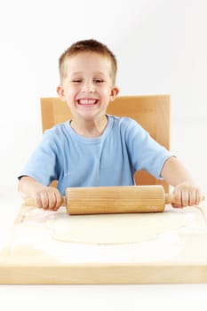 Small boy baking cookies for Christmas