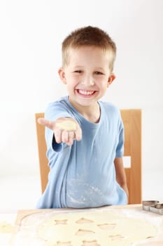 Lovely boy baking cookies for Christmas