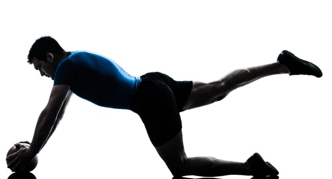 one caucasian man exercising workout holding fitness ball posture in silhouette studio  isolated on white background