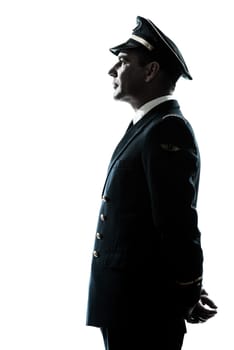 one caucasian man in airline pilot uniform silhouette in studio isolated on white background