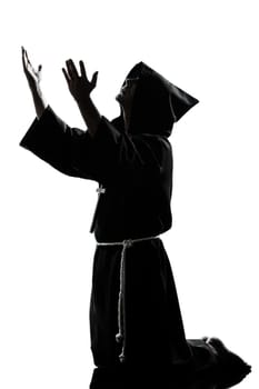one caucasian man priest praying silhouette in studio isolated on white background
