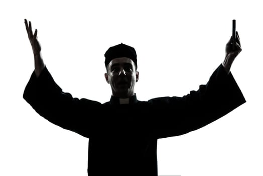 one caucasian man priest silhouette blessing in studio isolated on white background